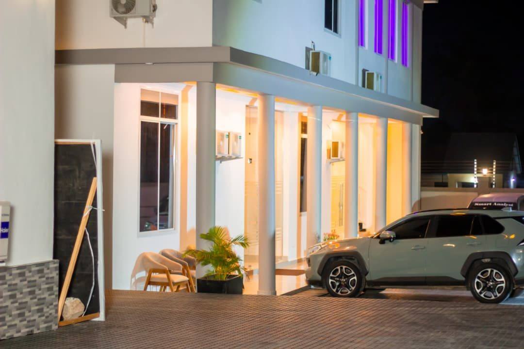 The entrance portico and parking at night